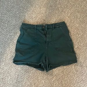 Universal Thread Women's High-Rise Utility Shorts in a Dark Green Color.